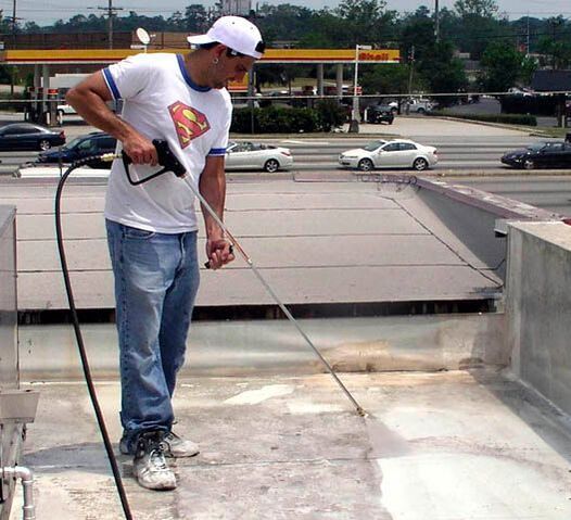Power washing commercial roof